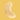Close-up of a single raw cashew nut on a peach background